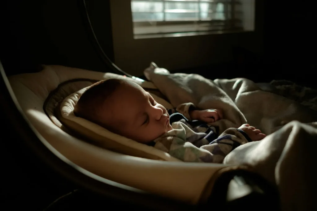 Baby sleeping peacefully in dim light and calm environment 