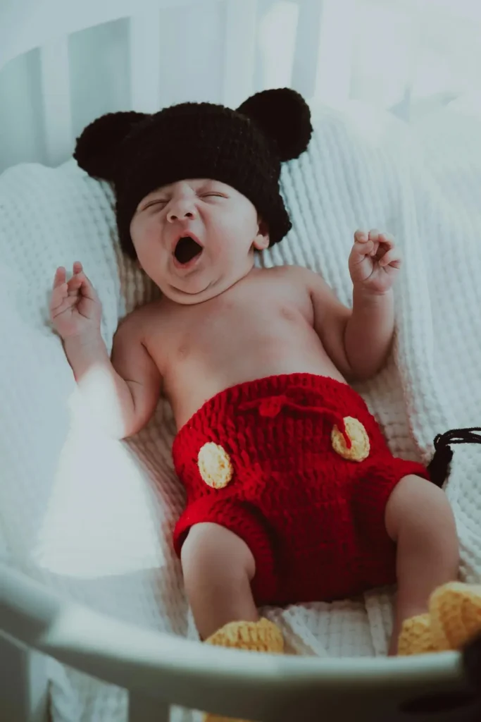 baby showing overtired signs like yawning before nap