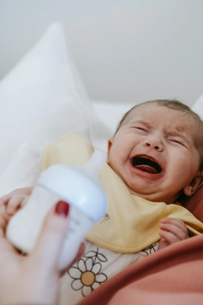 baby showing overtired signs like crying before nap
