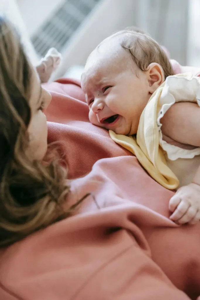 mother soothing baby crying before bedtime